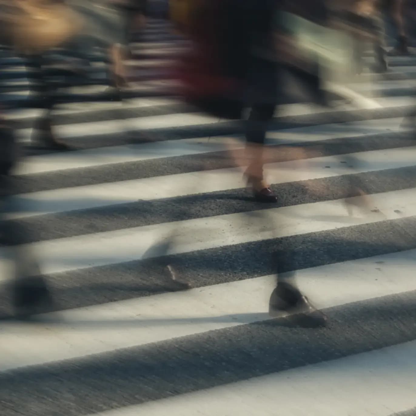 crosswalk blurred feet